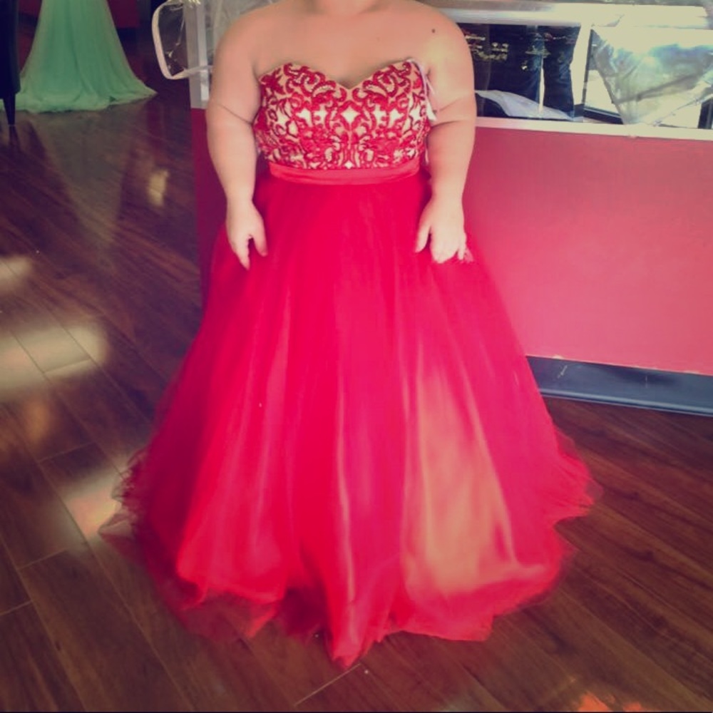 A red and beige embroidered prom dress